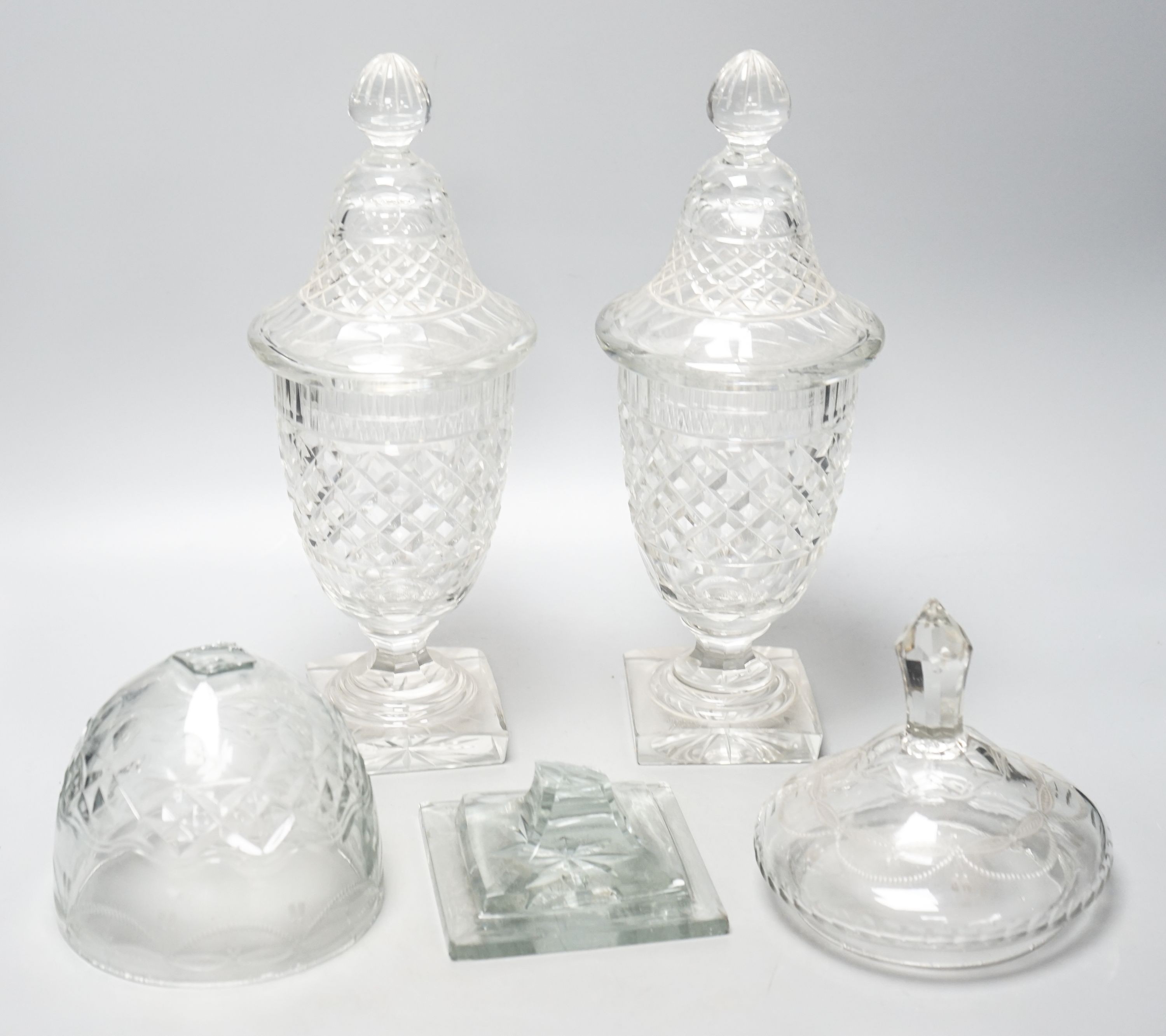 A pair of 19th/20th century cut glass sweetmeat jars and covers, H 33cm, and another (a.f.)